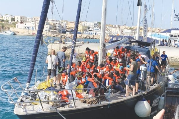 Rescue ship with nearly 300 migrants aboard docks in Sicily