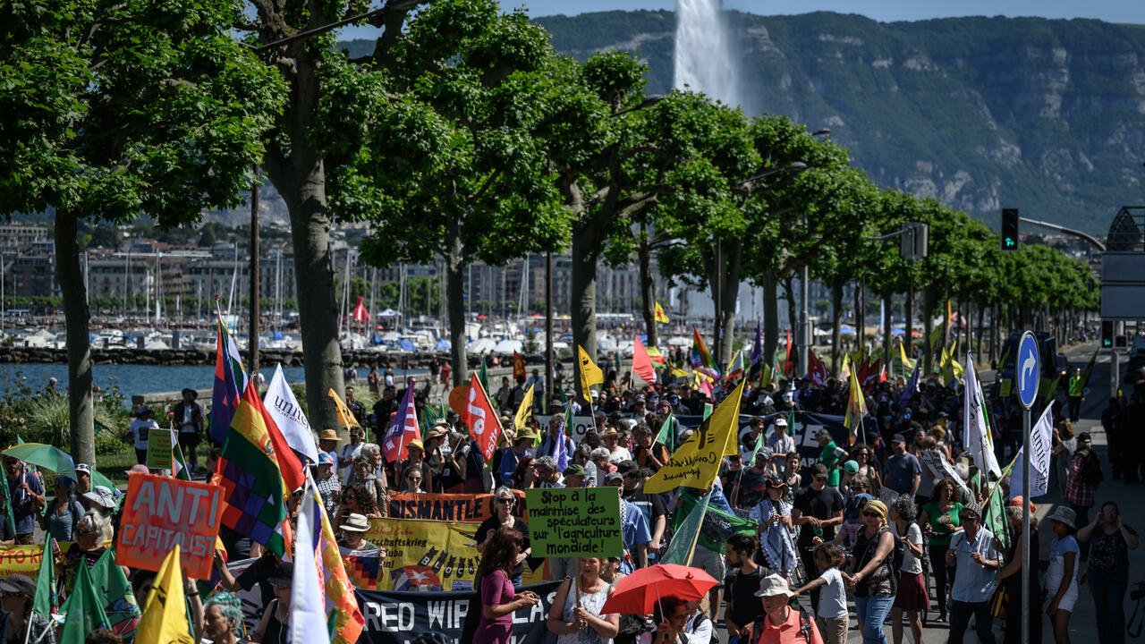 Protesters march in Geneva against WTO role in agriculture