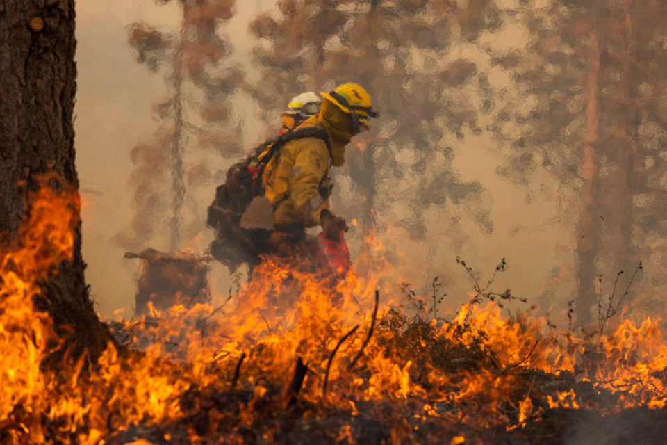 Firefighters tackle California wildfire as heat wave grips parts of US