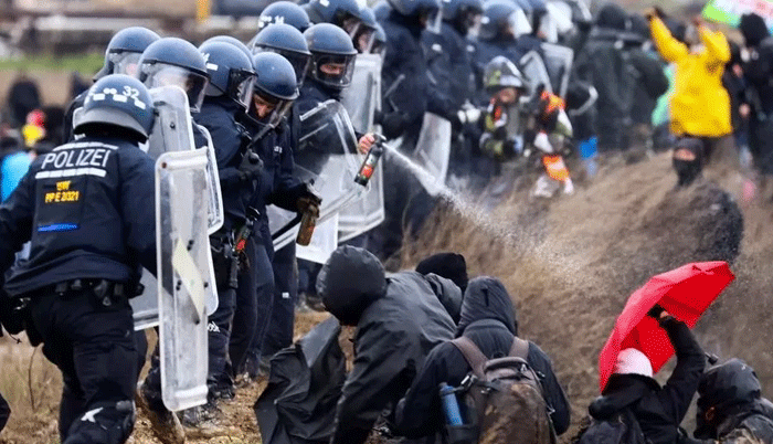 German police oust climate activists after clashes near coal mine