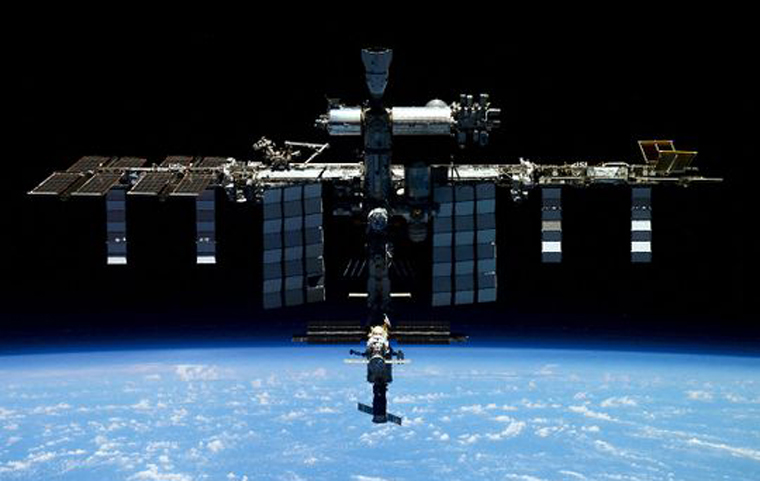 Russian ship docks with ISS to replace damaged capsule