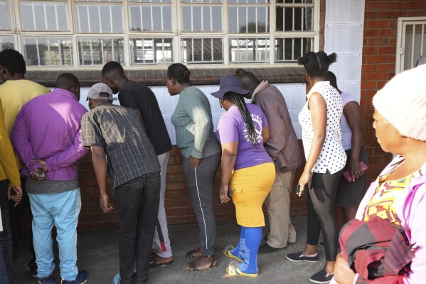 Zimbabwe police arrest 41 election monitors as votes are counted after widespread delays