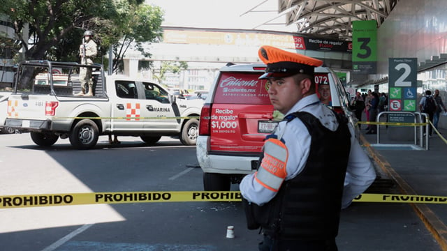 Mexico City airport shooting leaves two police injured