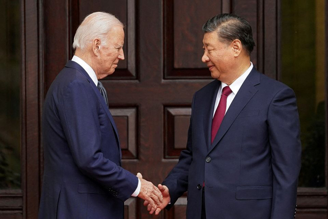 Presidents Biden, Xi shake hands at first meeting for a year