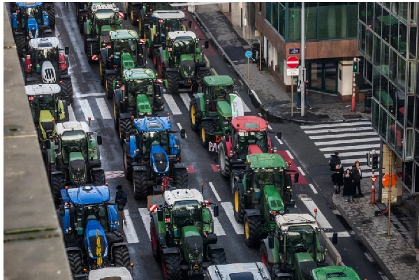 Protesting farmers hurl eggs and clog streets with tractors as EU summit begins