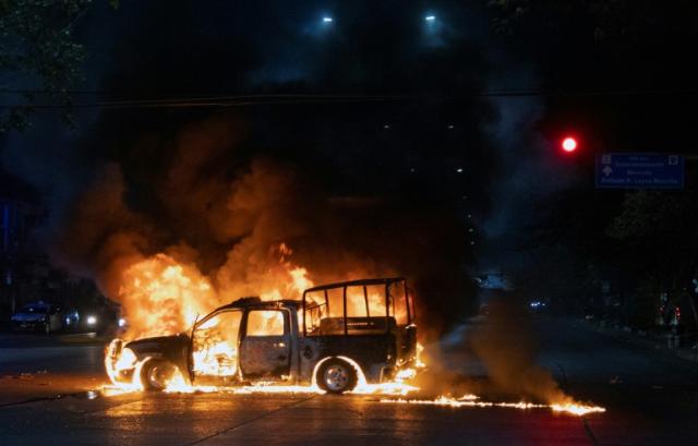 Protesters set fire to two patrol cars in southern Mexico