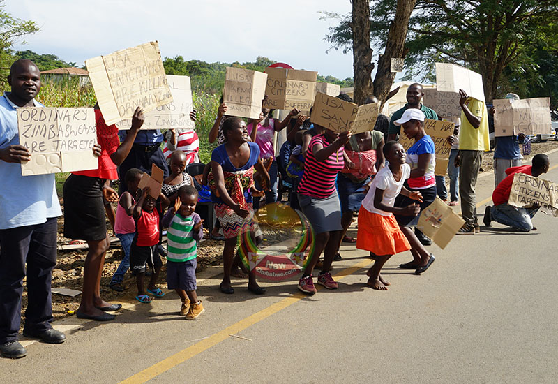 Zimbabweans camping in front of U.S. embassy in protest at new US sanctions