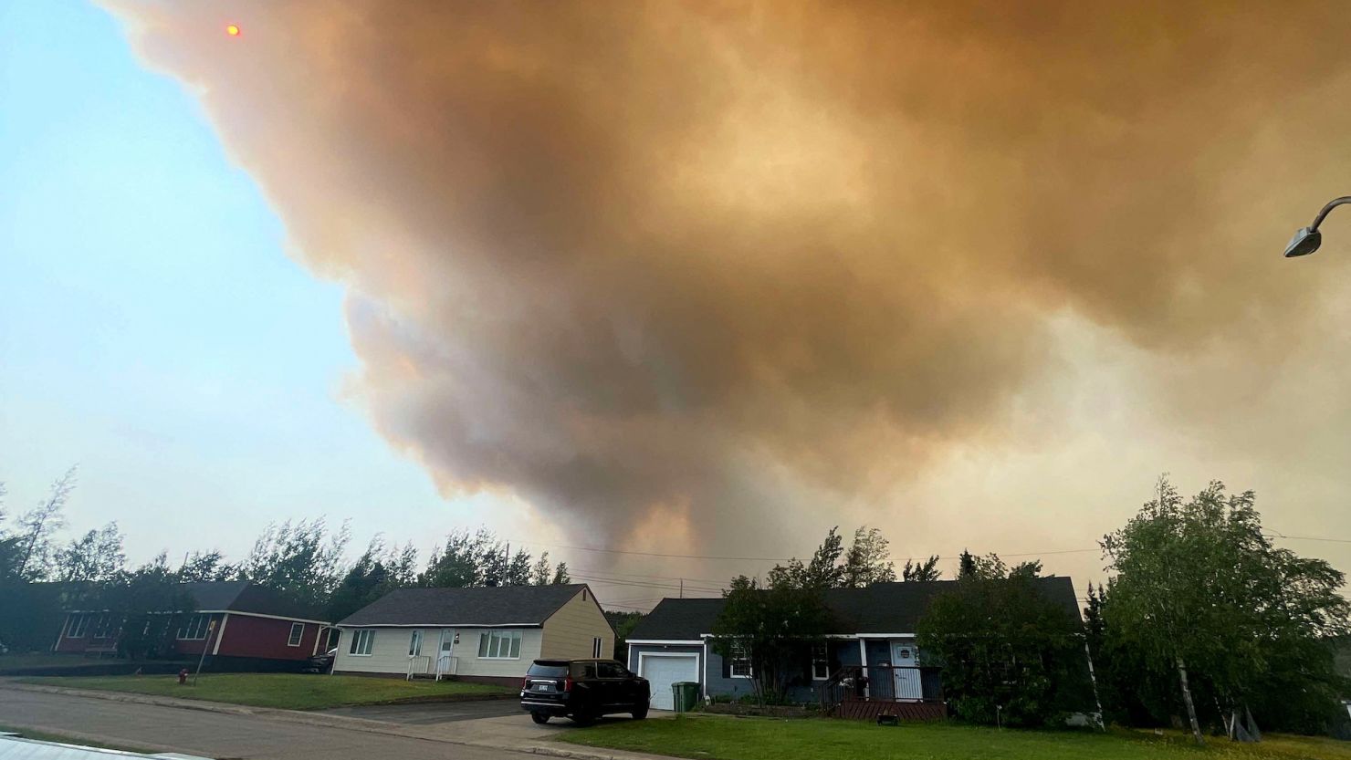 Thousands evacuated as ‘extremely aggressive’ wildfire burns in eastern Canada