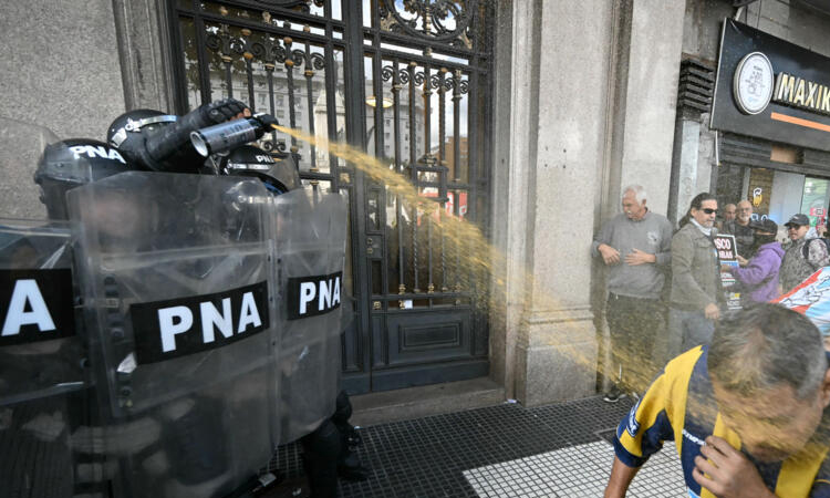 Argentine football fans clash with police at pensions march